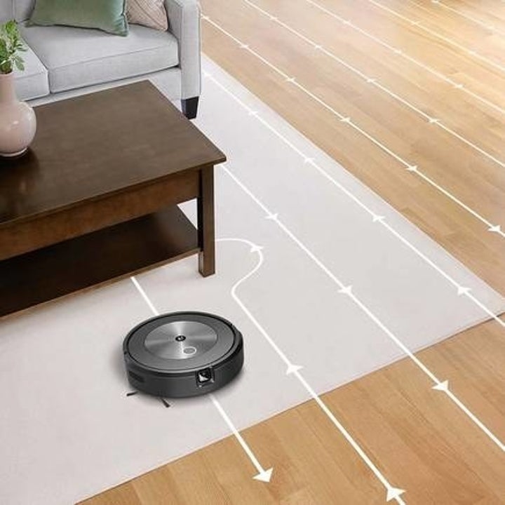 The Roomba cleans the floor in a pattern