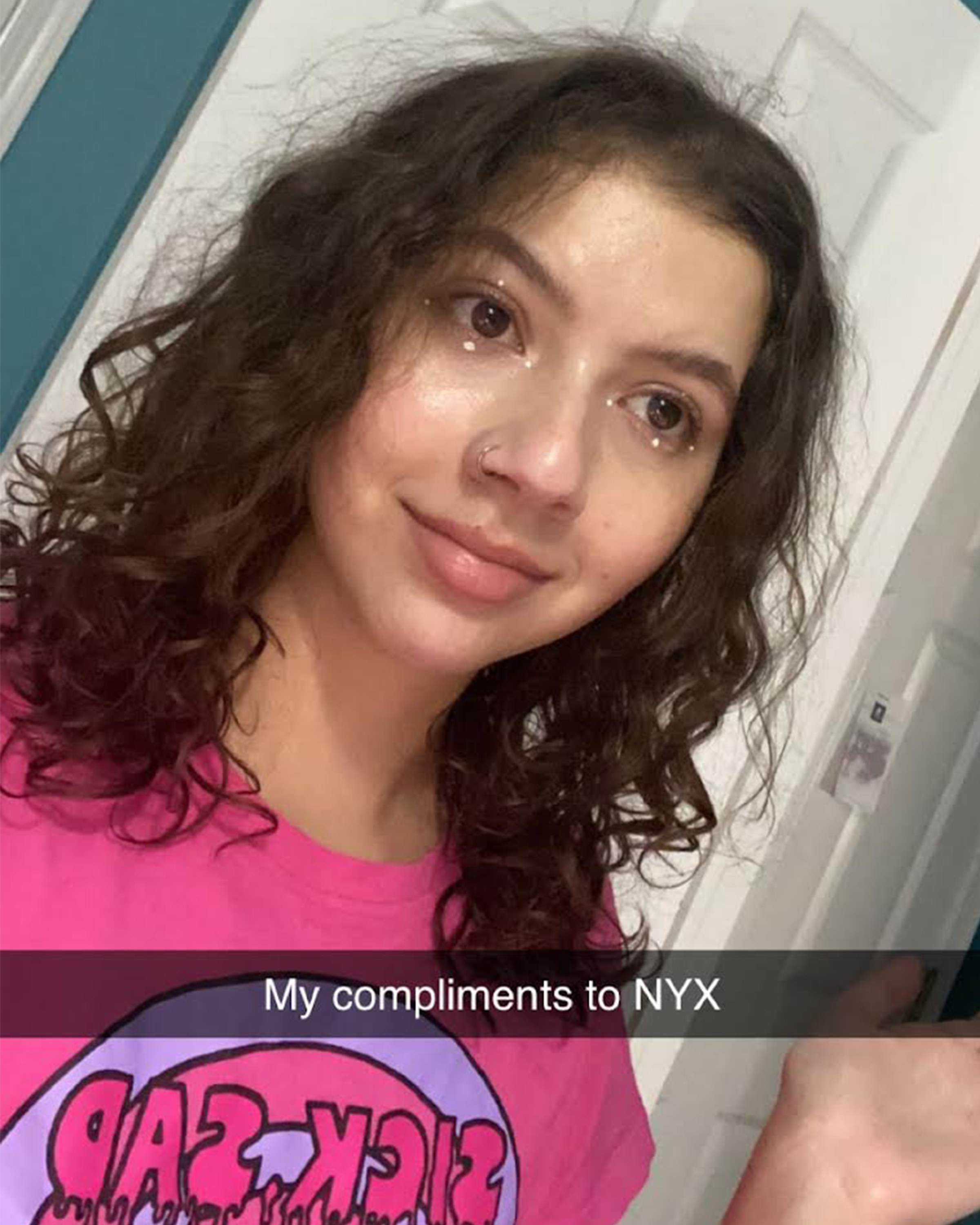 BuzzFeed Staffer Maya Ogolini smiles in a Snapchat selfie with a caption that reads &quot;My compliments to NYX&quot;