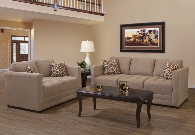 Two brown couches around dark brown coffee table