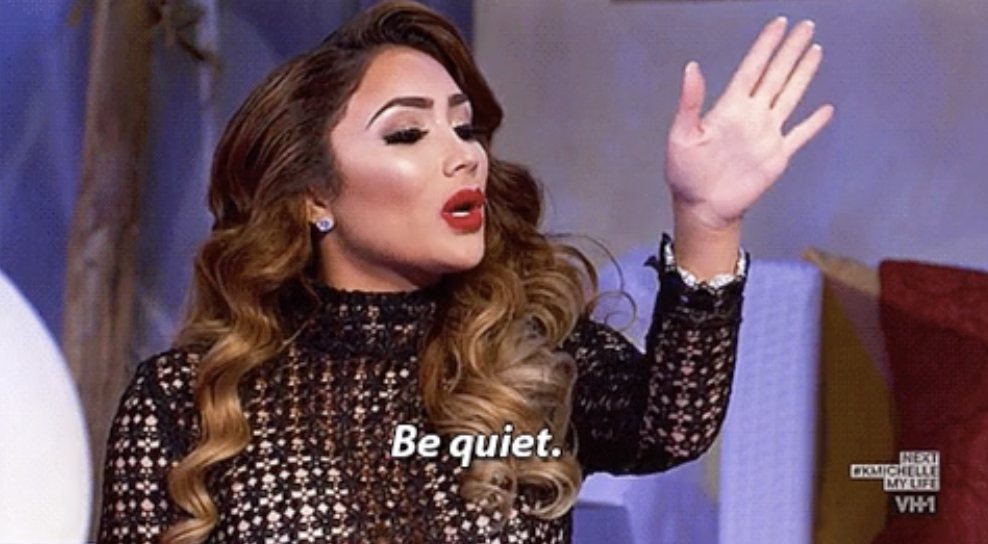 A woman saying &quot;be quiet&quot;