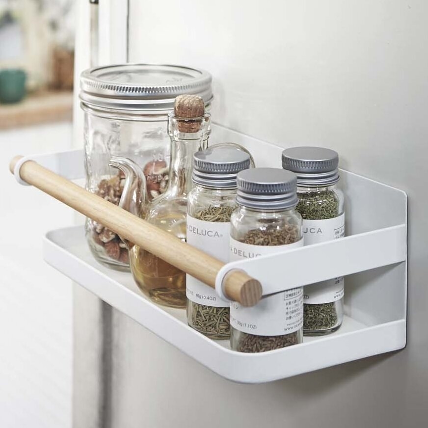 The magnetic rack holding multiple jars of spices