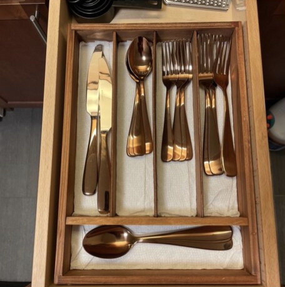 wooden organizer with copper utensils