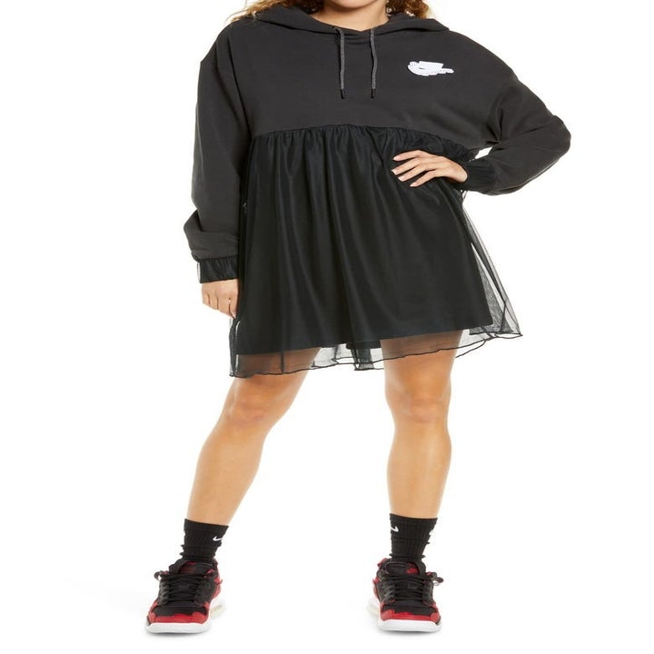 Model wearing a Nike jersey and tulle hoodie