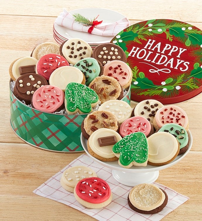the open cookie tin with festive red and green cookies