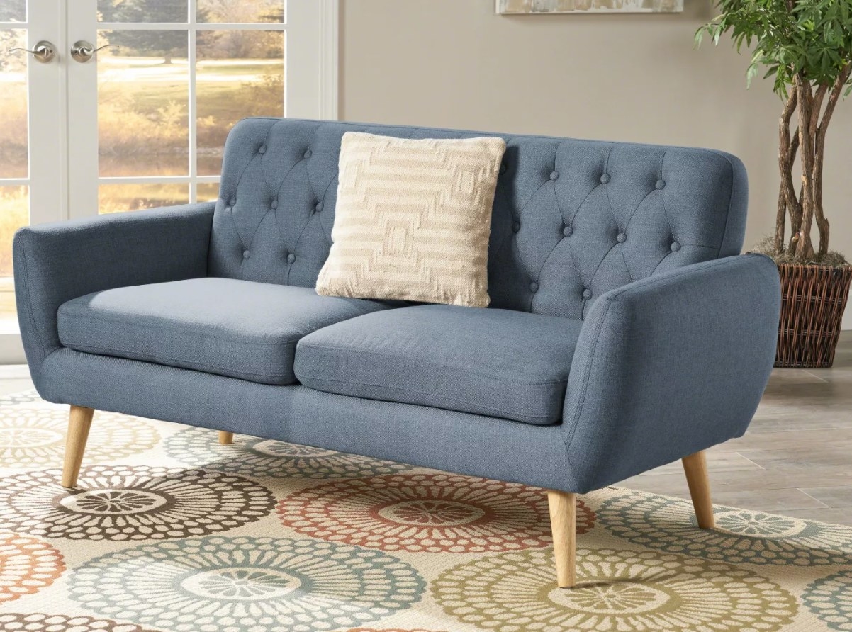 Blue tufted couch