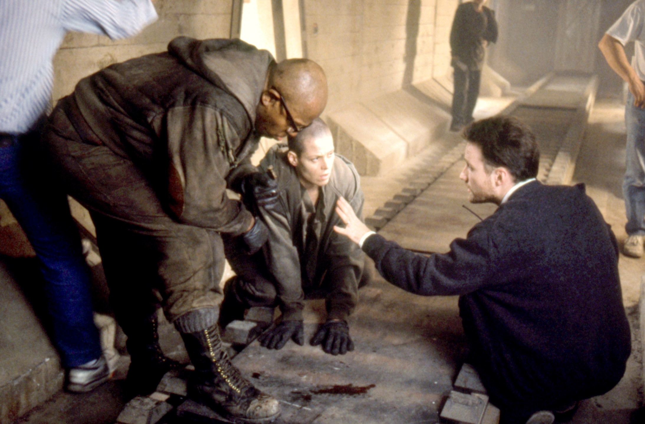 Charles Dutton, Sigourney Weaver, and director David Fincher on set of &quot;Alien 3&quot;