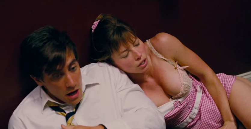 Jake Gyllenhaal and Jessica Biel laying together on the floor