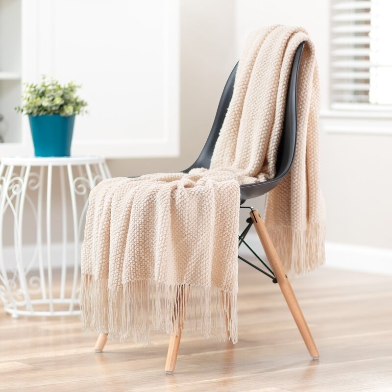 a chair and a throw blanket