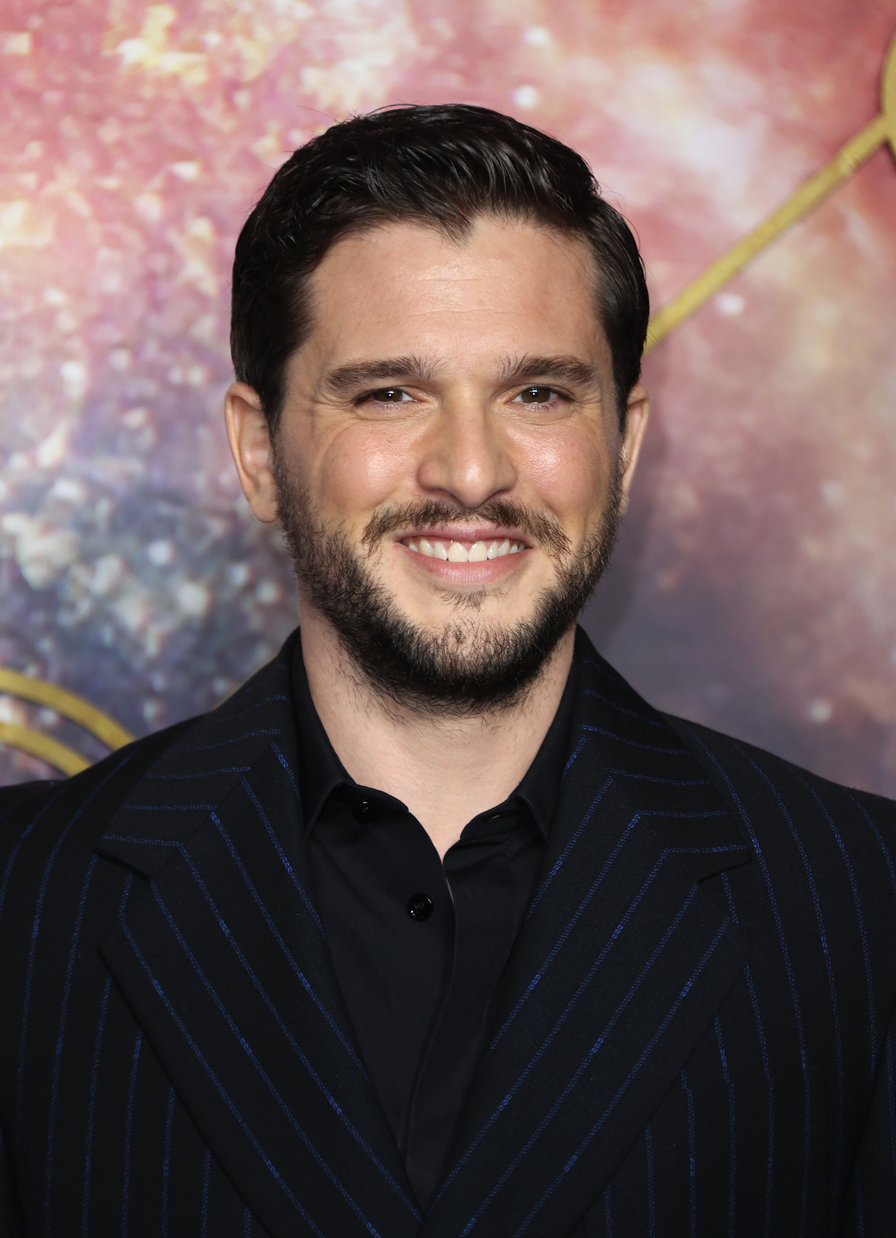Kit Harington smiles.