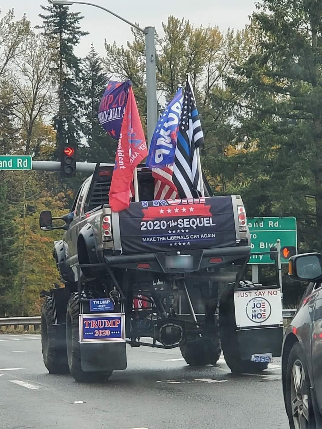A pickup truck with huge lifted wheels and tons of pro-Trump flags and stickers that say things like &quot;2020 the sequel make the liberals cry again&quot;