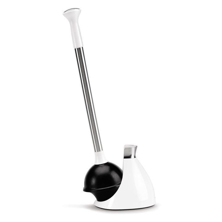 The same white toilet plunger being displayed outside the dome shaped cover