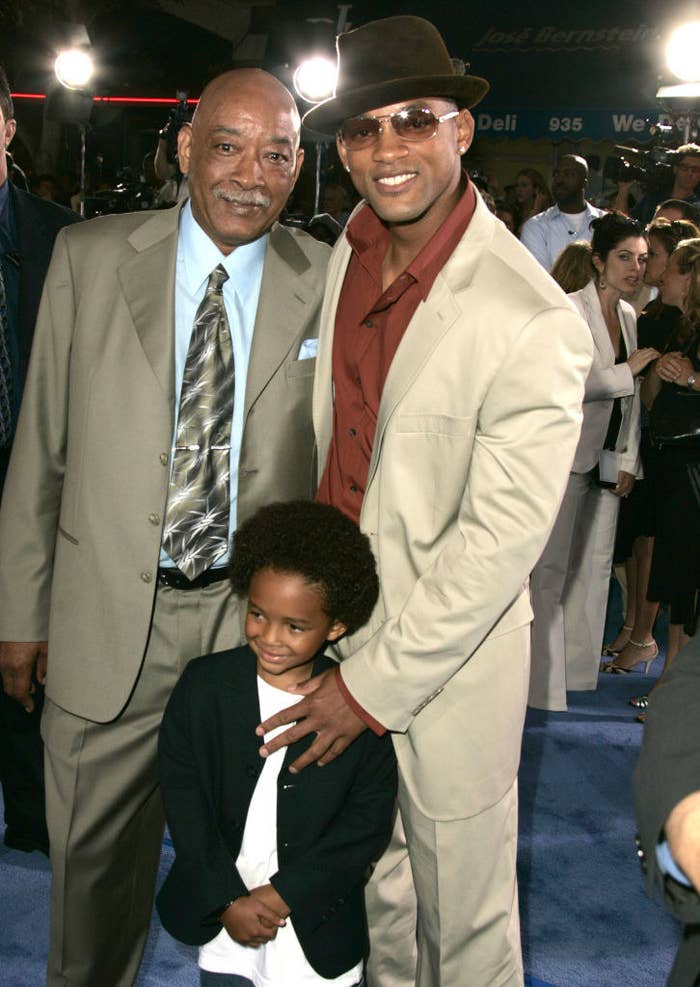 Will poses on a red carpet with his son Jaden as a toddler and father