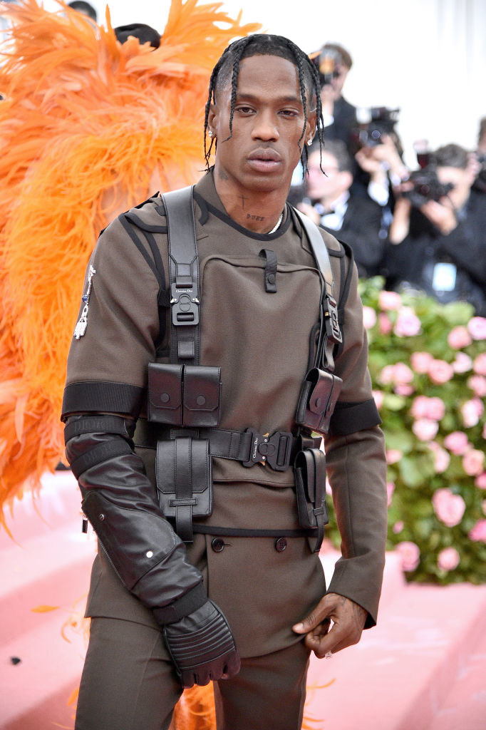 Travis poses on the steps at the Met Gala