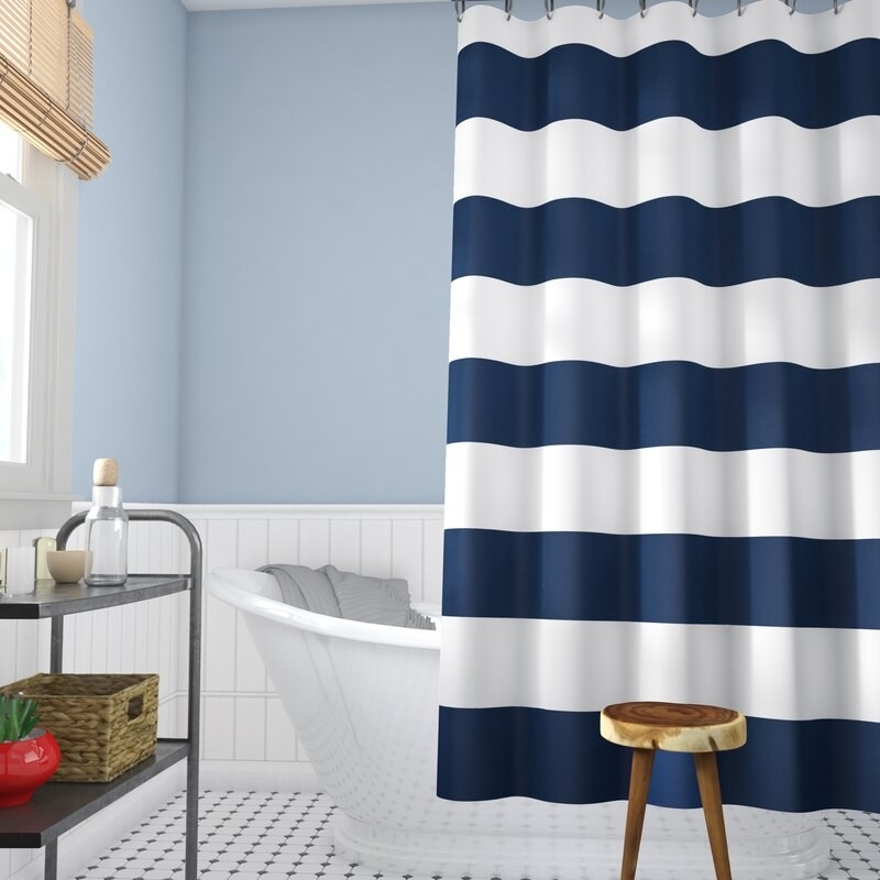 The shower curtain featured in a bathroom.