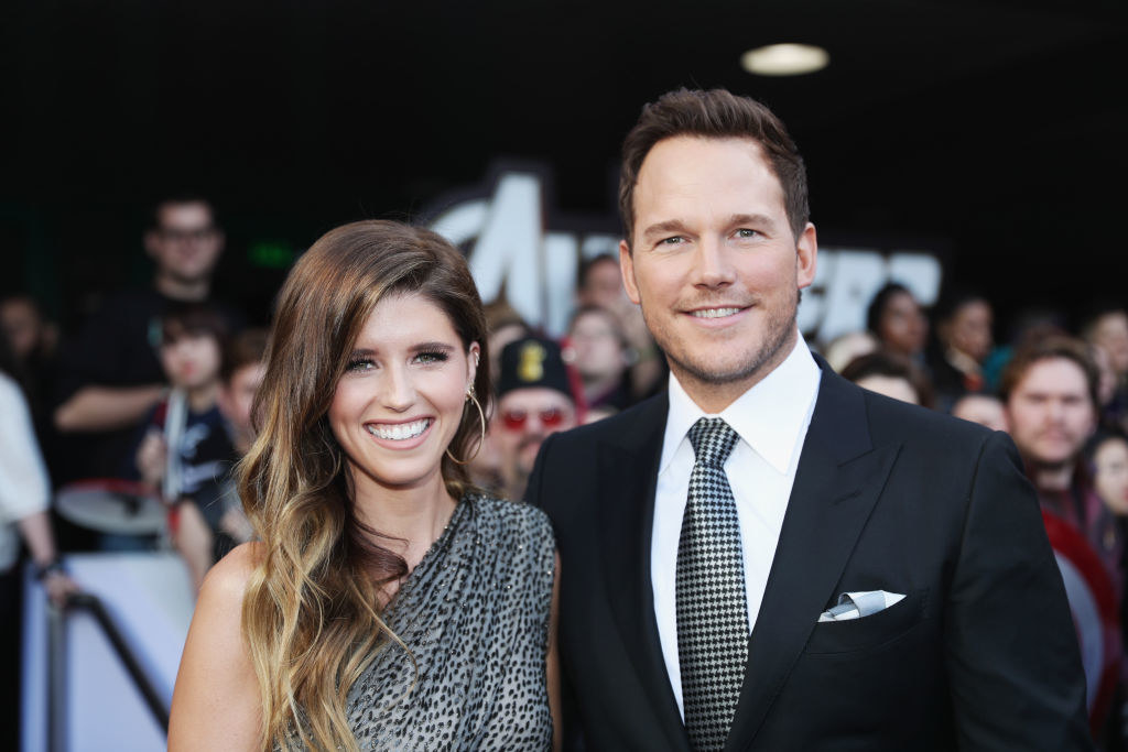 Katherine and Chris smiling at a red carpet event