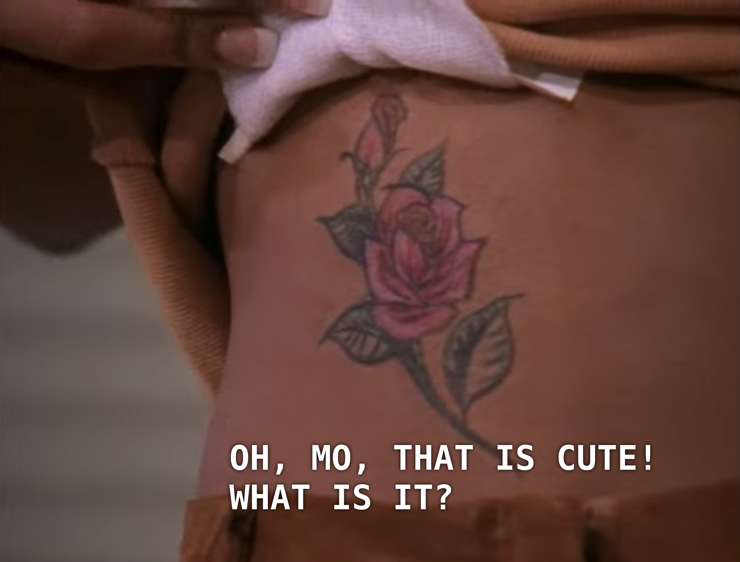 It's a close-up on Moesha's rose tattoo.