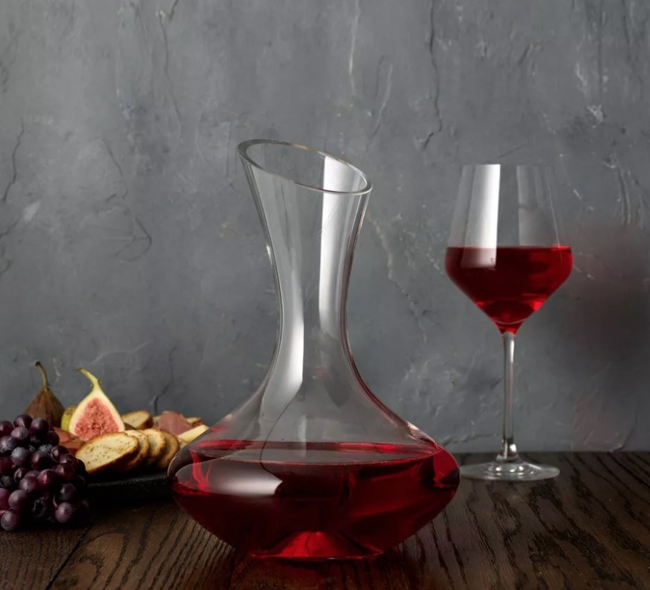 A wine decanter filled with red wine