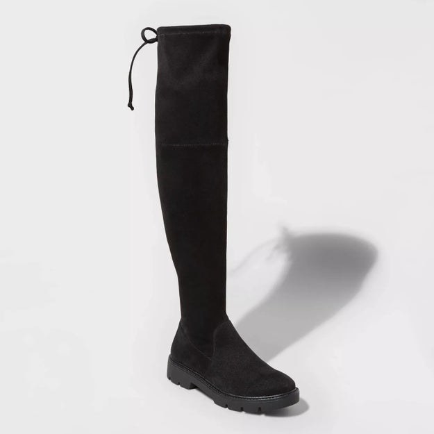 The black boot with black sole, and black string detail around calf area