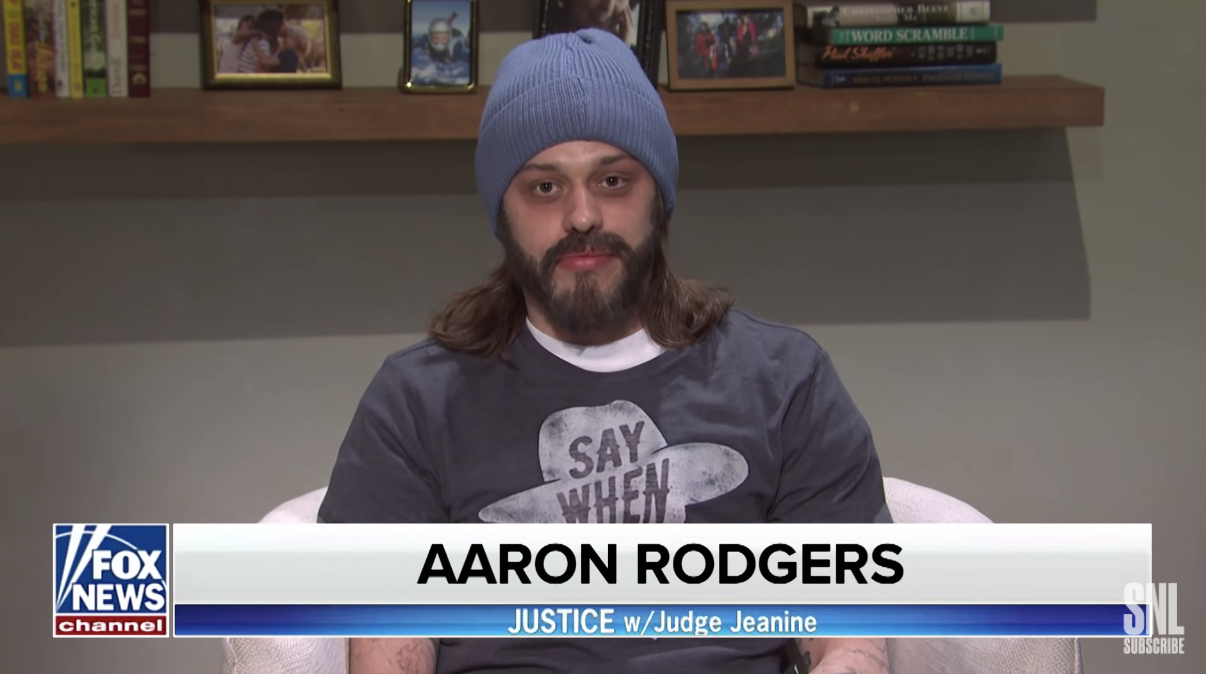 Pete as Aaron Rodgers in a beanie and T-shirt