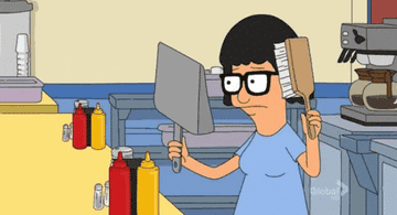 GIF of Tina from &quot;Bob&#x27;s Burgers&quot; brushing hair while looking at reflection in dust pan
