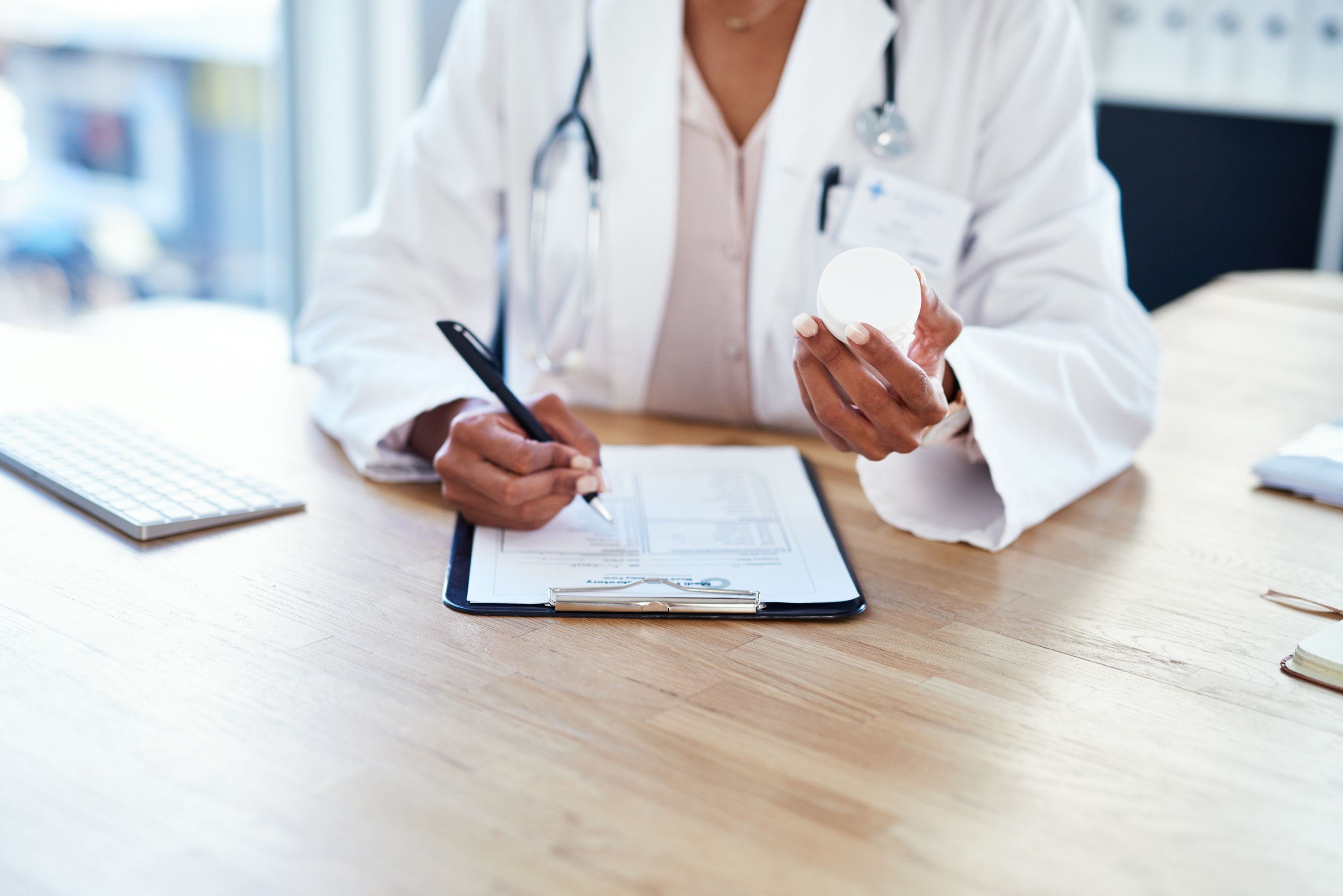 A doctor writing a prescription