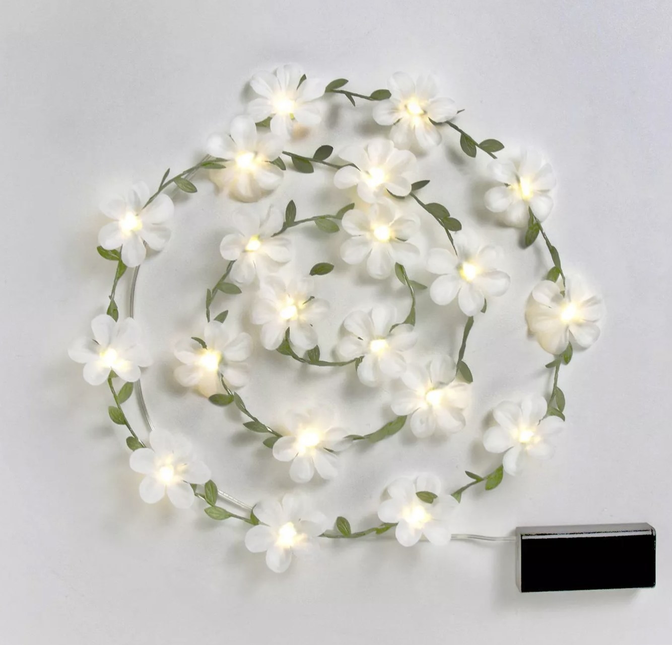 The white floral string lights have small green leaves and 20 warm bulbs