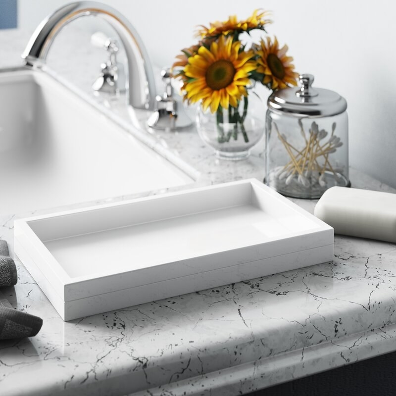 A white accessory tray on a counter.