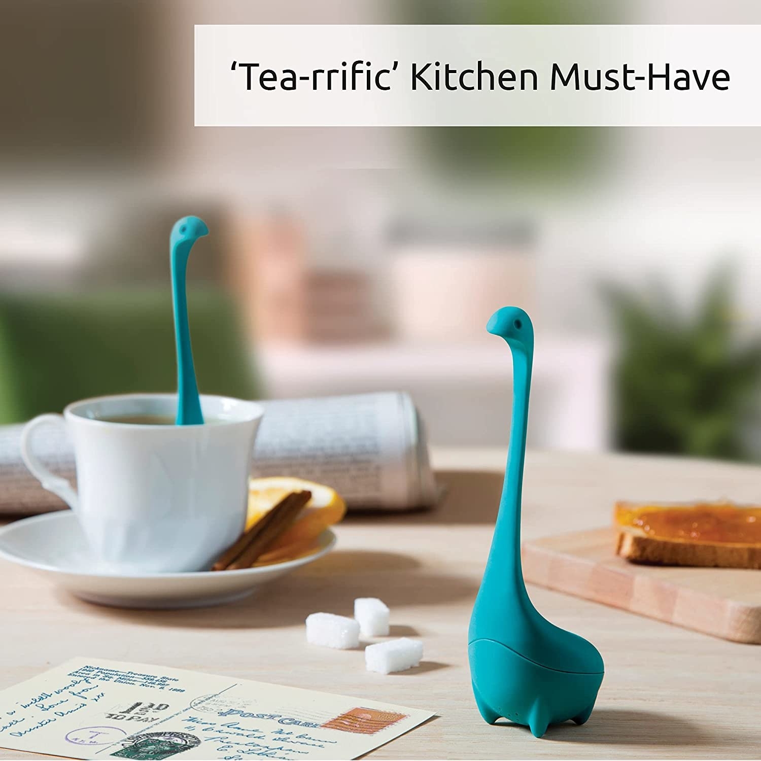 The teal infuser in a cup of tea