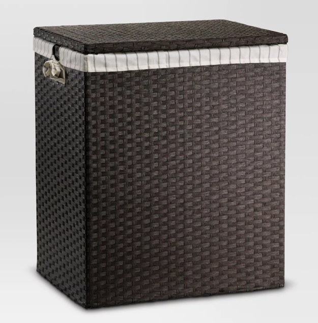 The brown woven hamper with its own lining inside