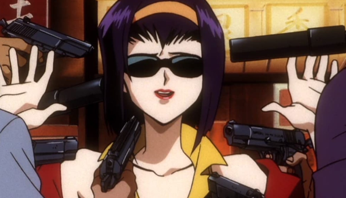 Faye with her hands raised as multiple guns are pointed towards her