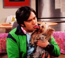 Raj kissing his dog
