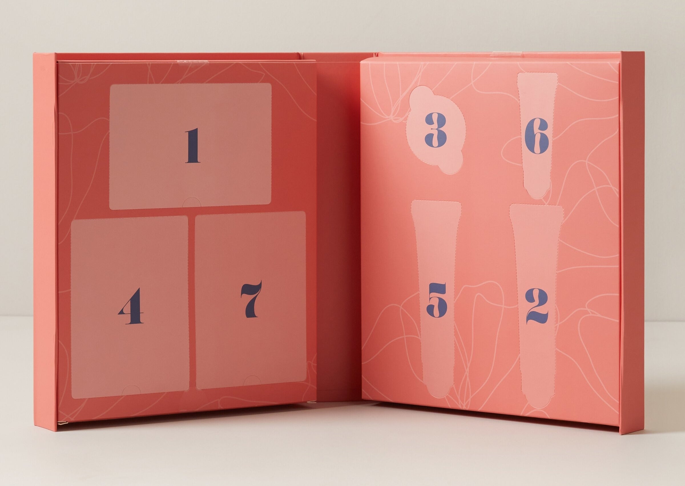 An advent calendar with seven pockets labeled on the inside