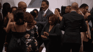 The cast dancing during a scene
