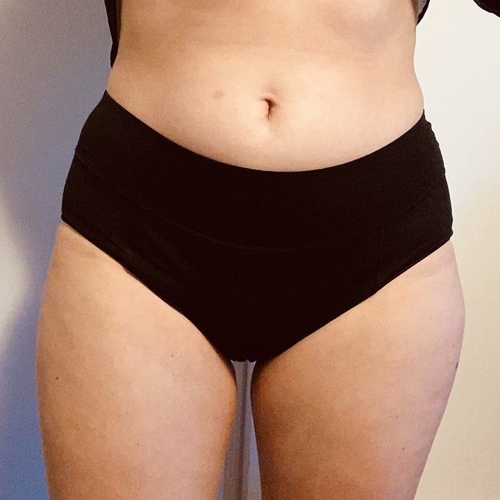 reviewer wearing black underwear