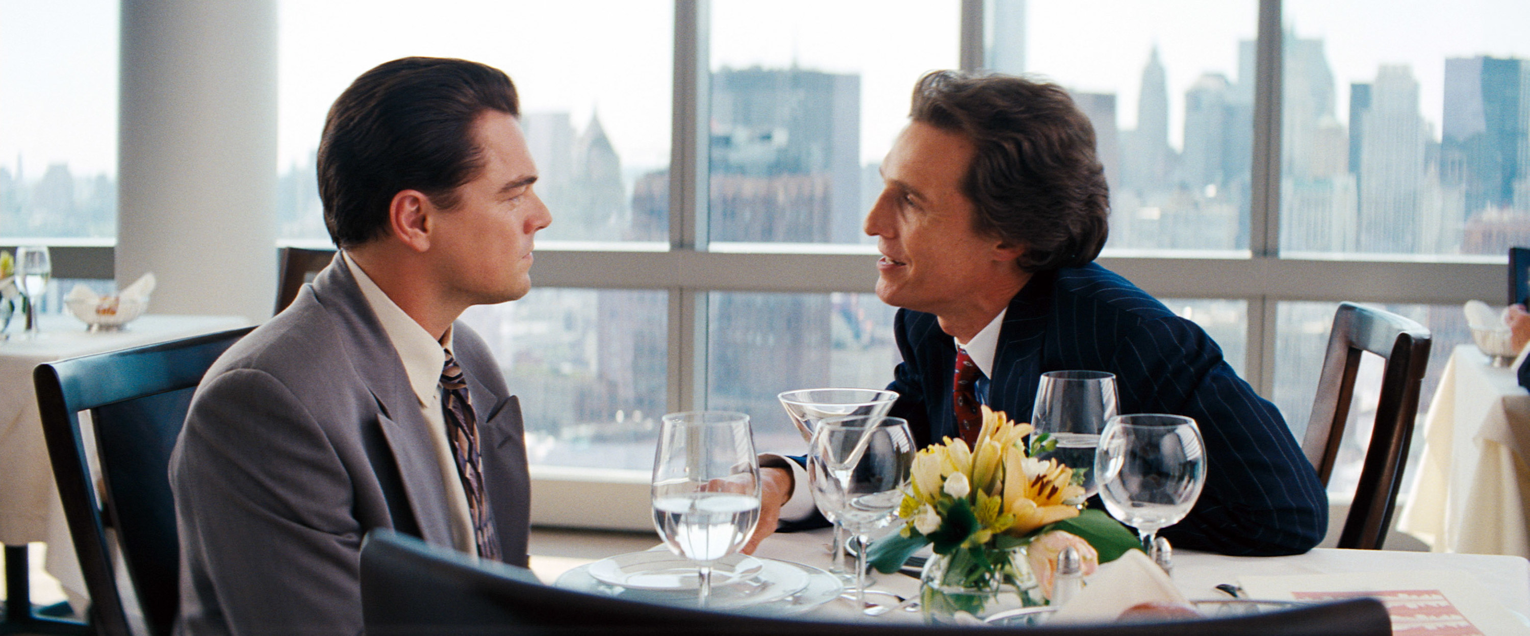 DiCaprio and McConaughey during the chest pounding lunch scene