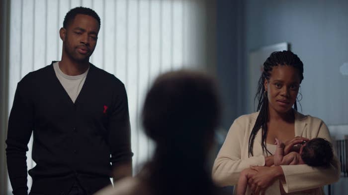 Lawrence standing next to Condola as she holds their baby