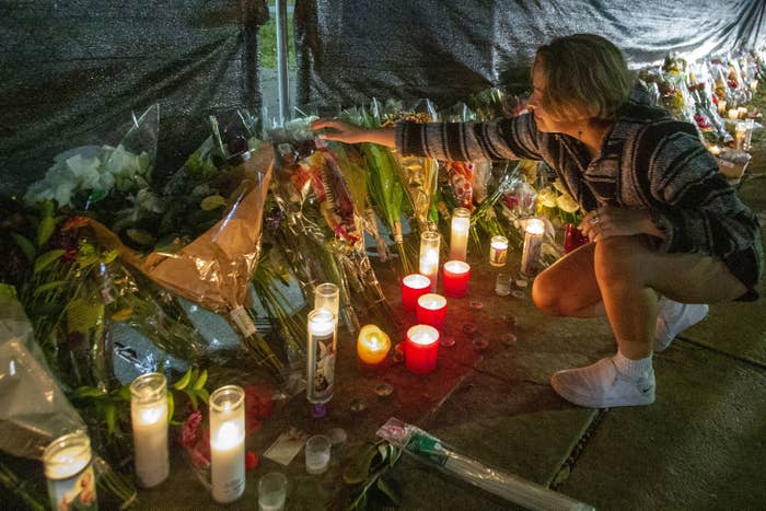 Fan laying flowers at the makeshift memorial located at NRG Park on November 6, 2021.