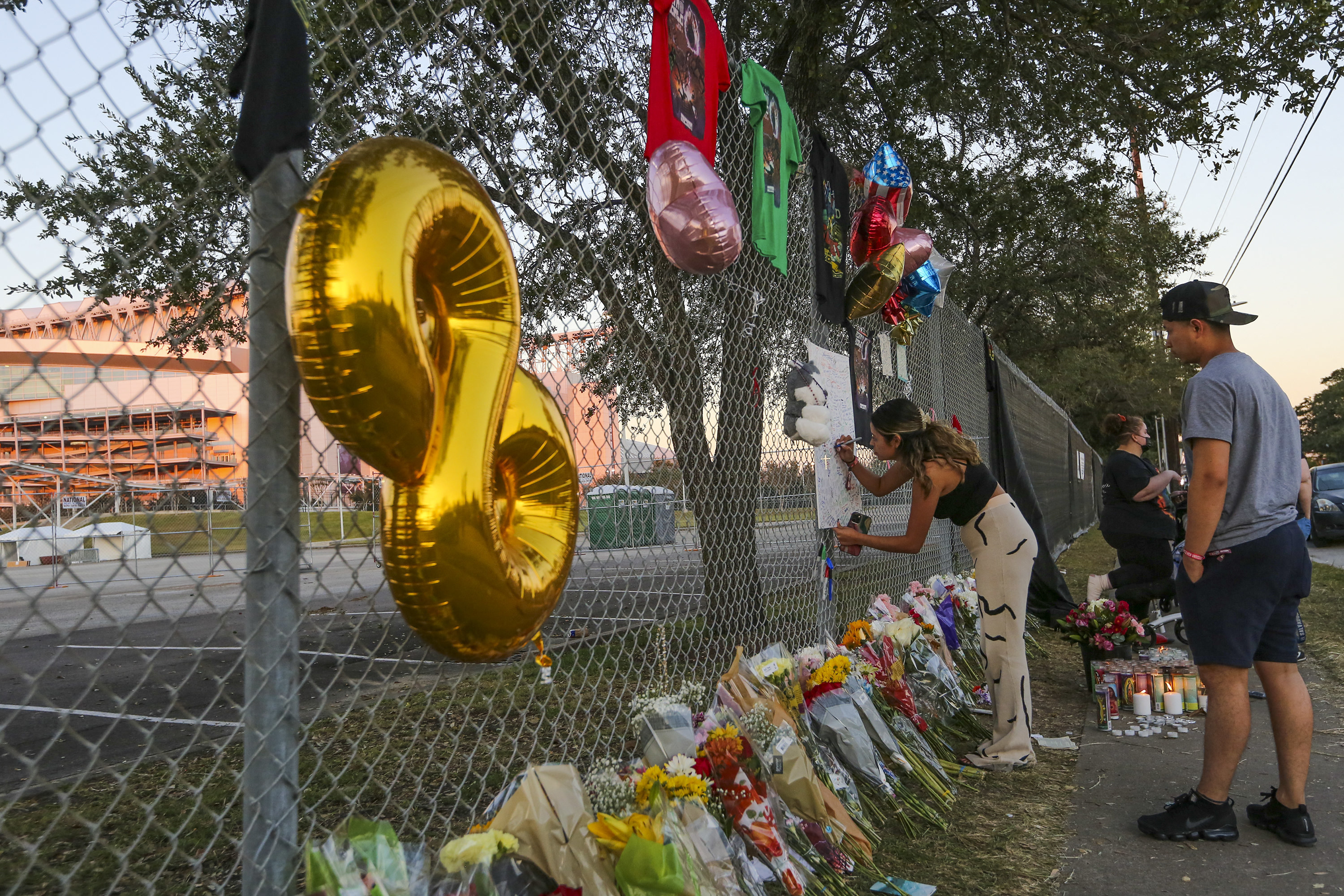 Fans sign makeshift memorial at NRG Park on November 6, 2021.