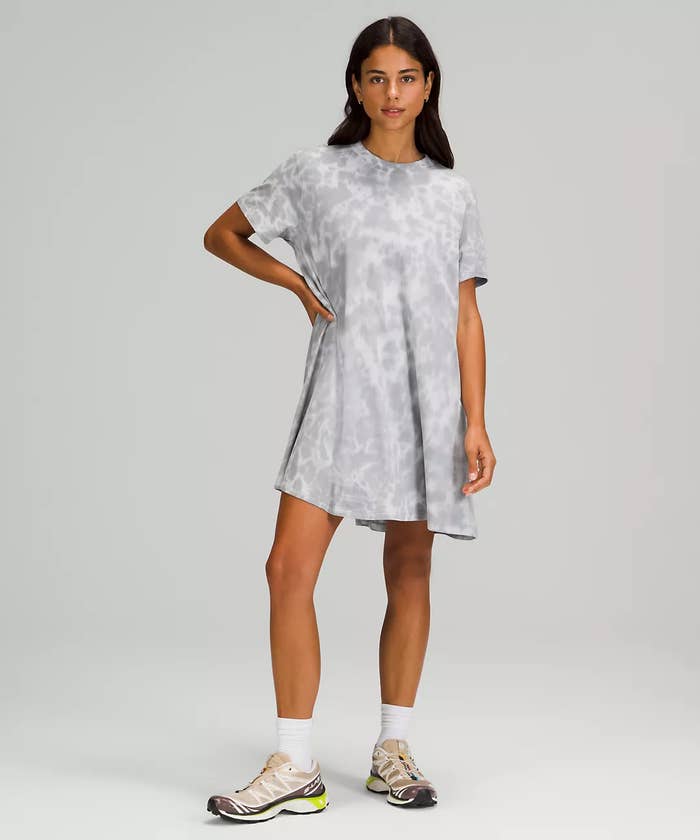 A person T-shirt dress with running shoes