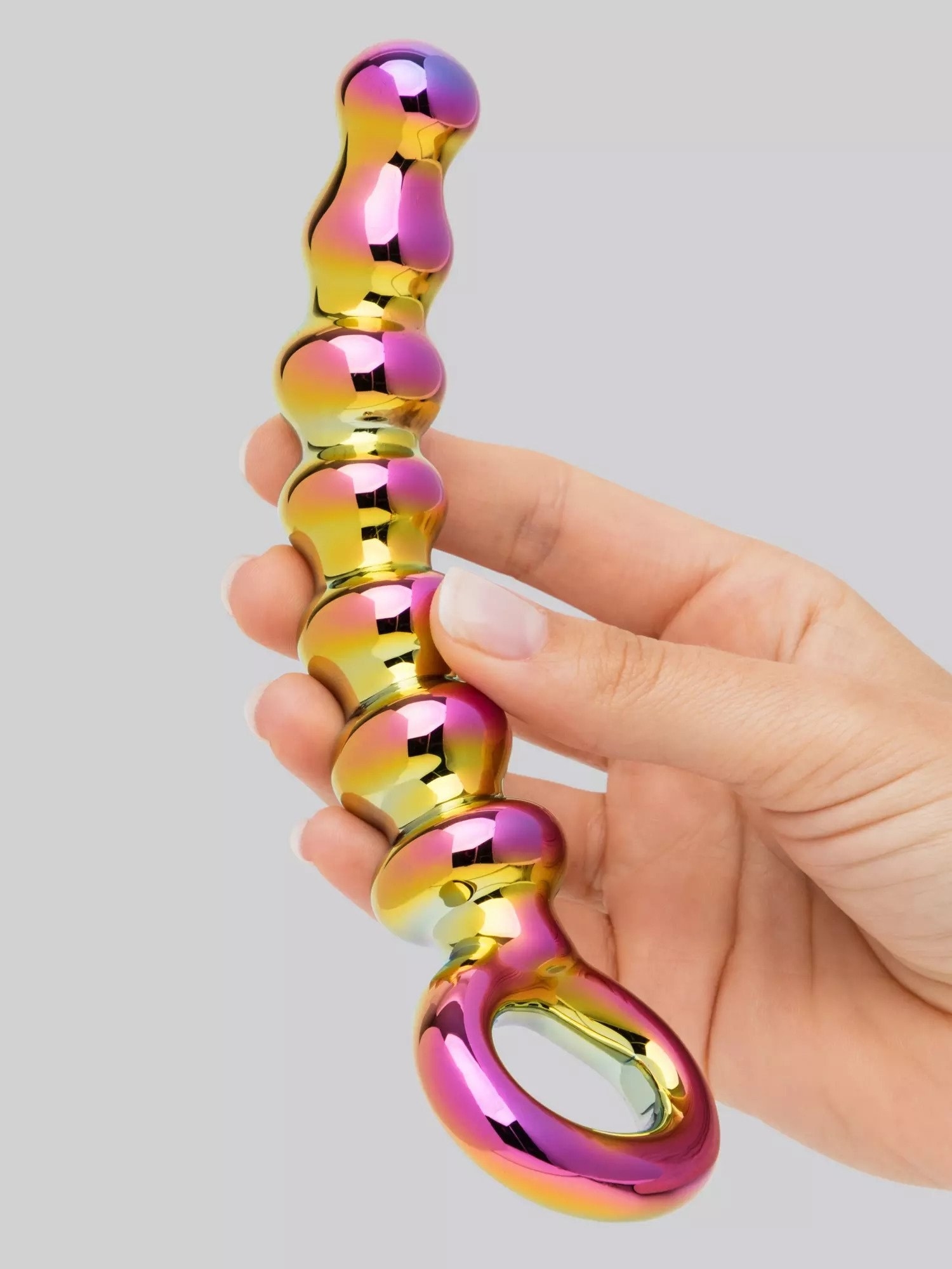 Model holding vibrant iridescent glass beaded plug