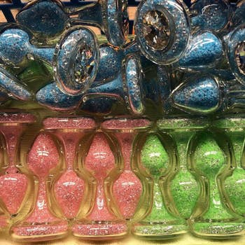 Transparent plugs filled with pink, blue or green crystals