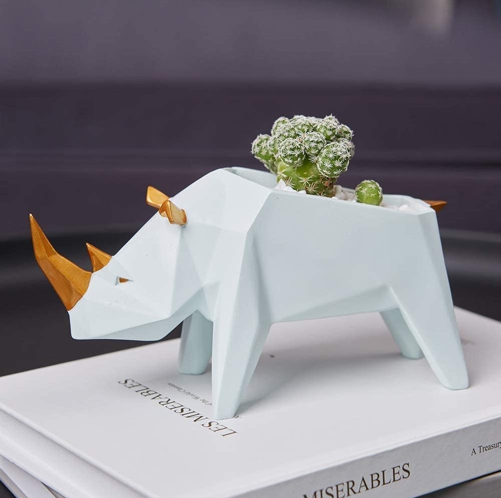 a geometric planter shaped like a rhino