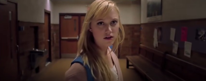 Girl looks scared inside a high school