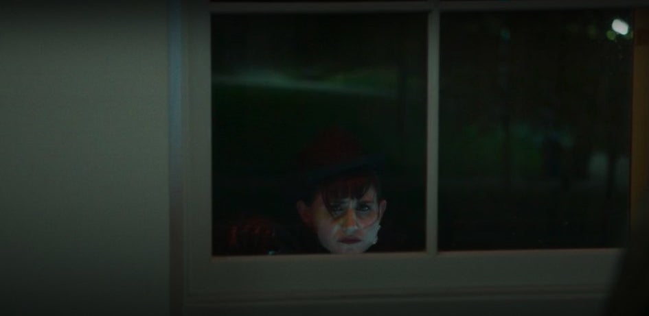 Nadja staring sadly through a window in &quot;What We Do in the Shadows&quot;