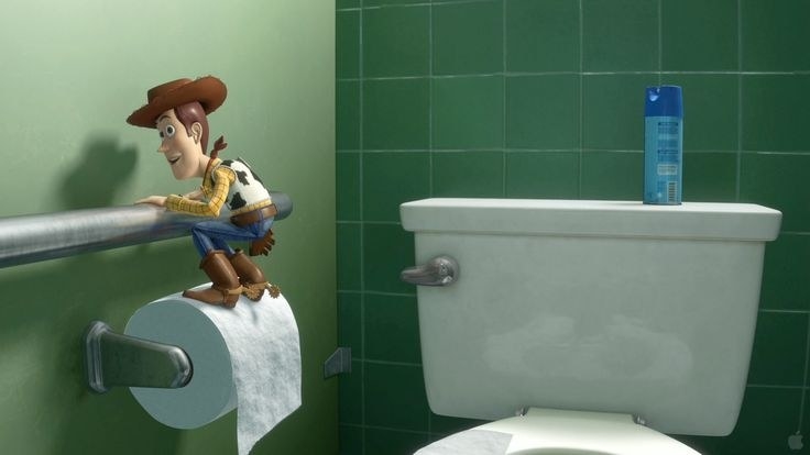 Woody from &quot;Toy Story&quot; standing on a roll of toilet paper
