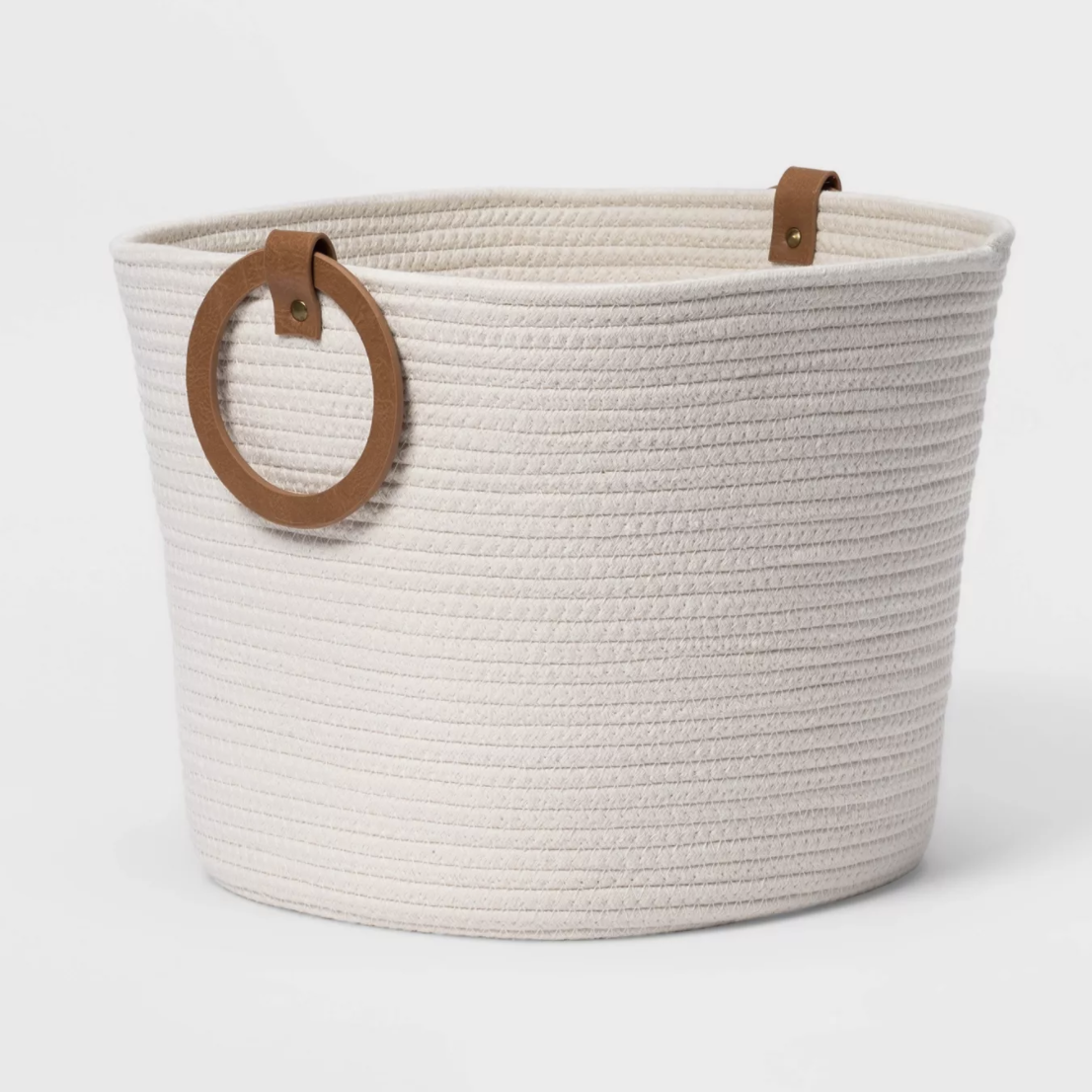 the white basket with a leather handle