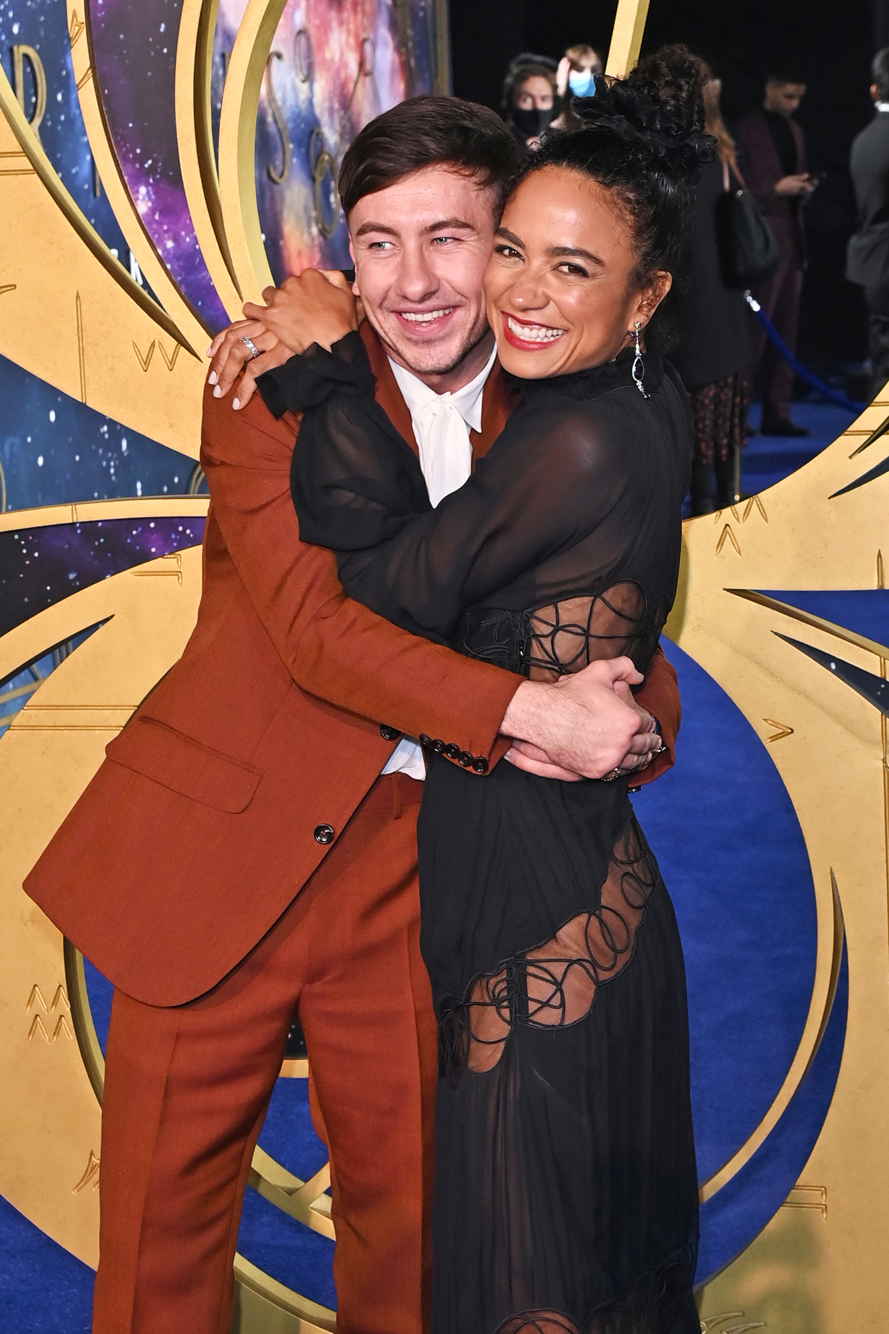 Barry and Lauren hugging on a red carpet