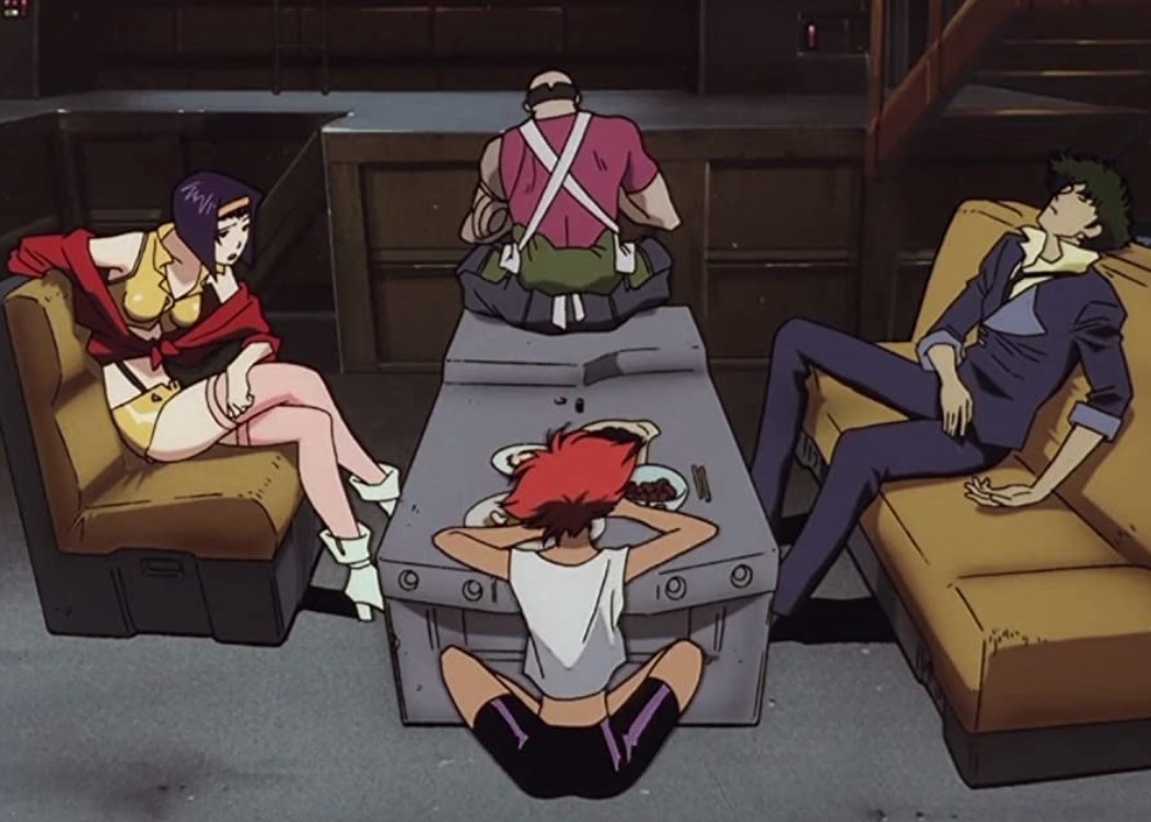 The Bebop crew sitting together stuffed after a eating a meal together
