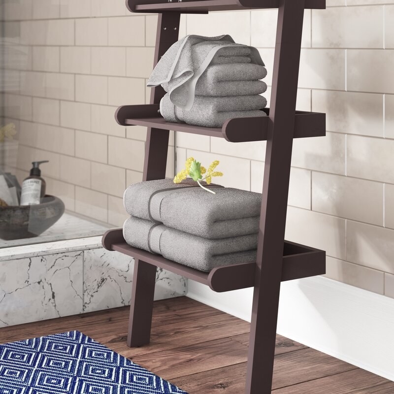 The gray towels on a shelf.