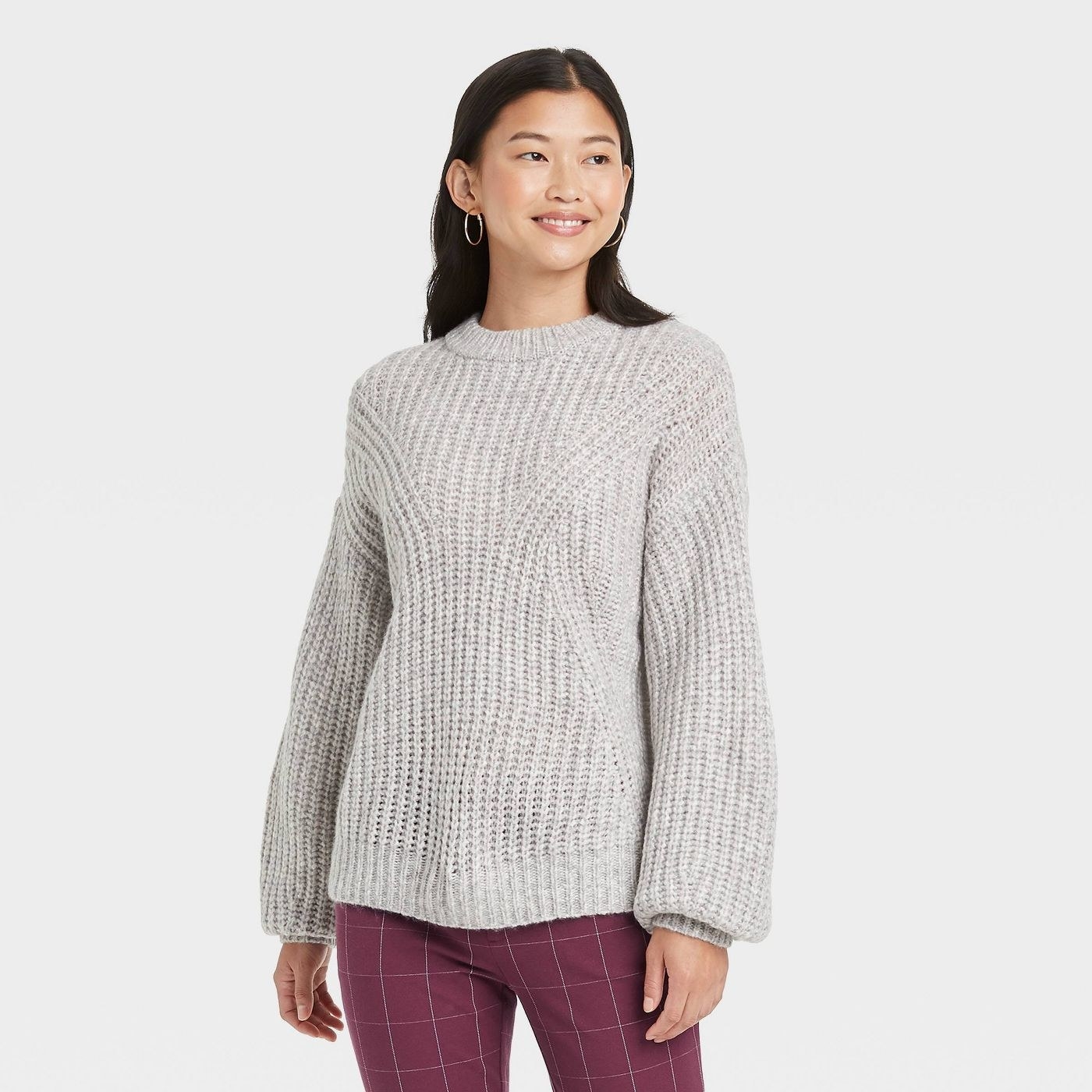 A grey pullover sweater
